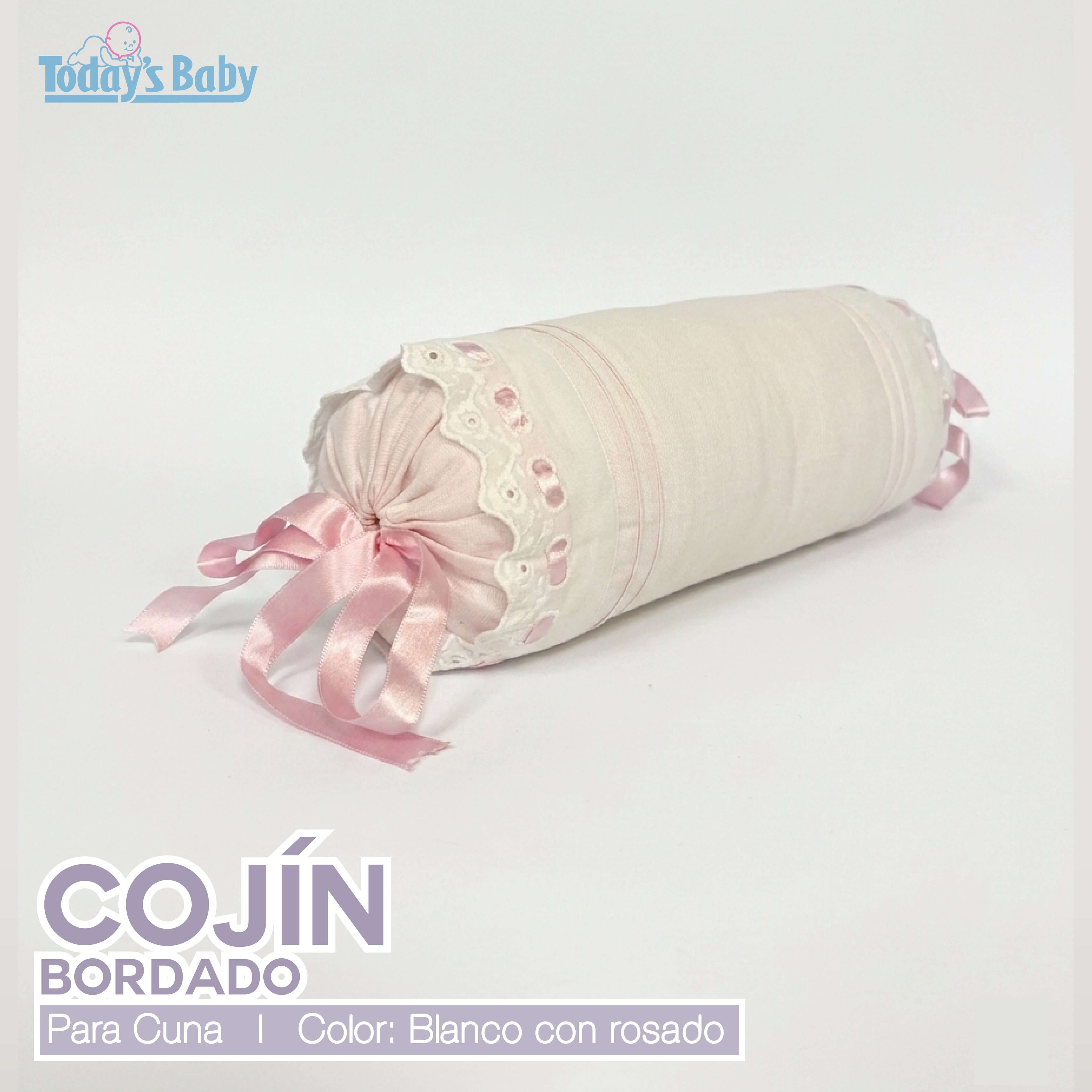 Cojín cilíndrico bordado para cuna blanco con rosado, decorativo y suave para el descanso del bebé.